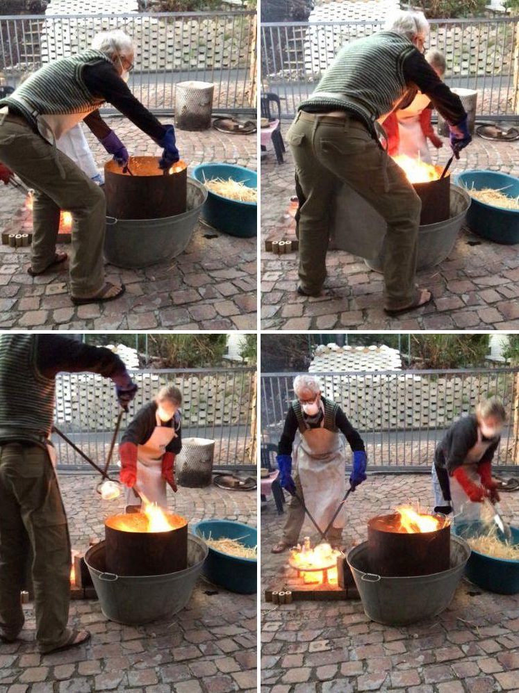Evan lifting red-hot masks from the raku kiln