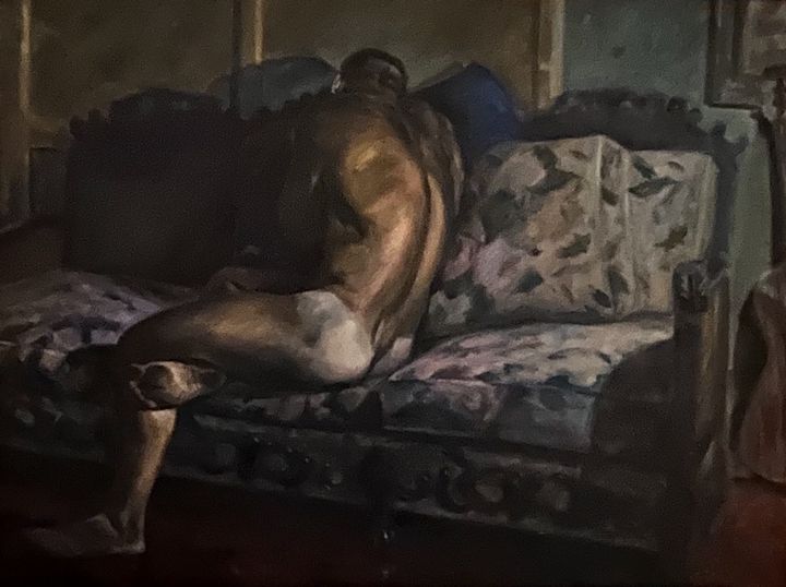 Man on Couch by Evan Oberholster — oil painting of a nude man lying on a couch in a dark interior